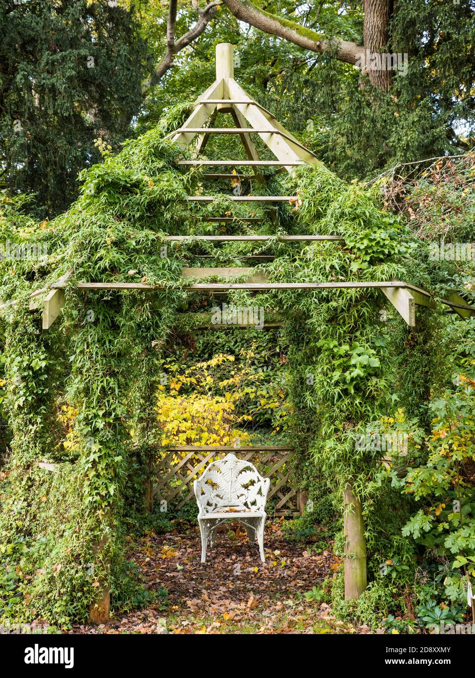 Country House Garden, Chair under Pagoda, Englefield House Gardens, Englefield, Thale, Reading, Berkshire, England, UK, GB. Stock Photo