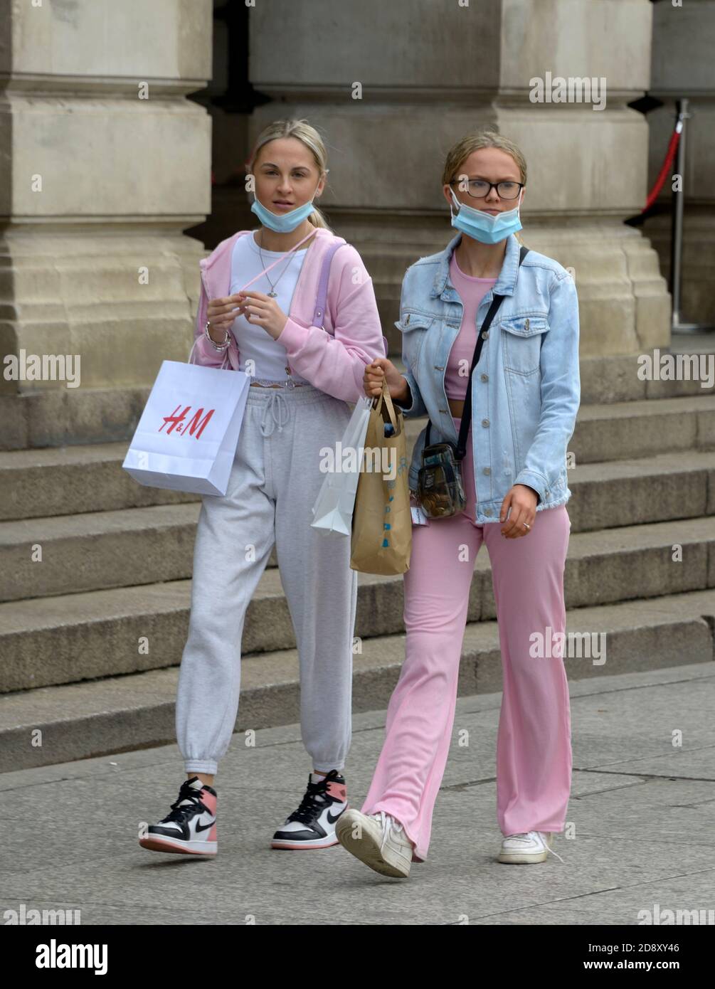 Two young girls in pink, with face masks. Stock Photo
