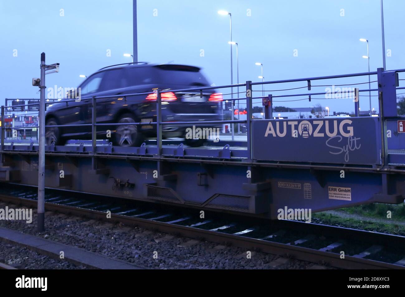 Westerland, Germany. 02nd Nov, 2020. Vehicles drive onto a DB Autozug at  the Sylt Auto Train loading station. Federal and state governments have  decided on a partial lockdown starting Monday because of