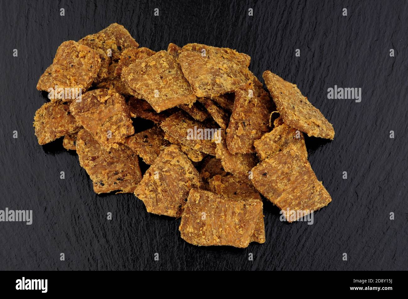 Plant based vegetarian high protein jerky snack on a slate stone