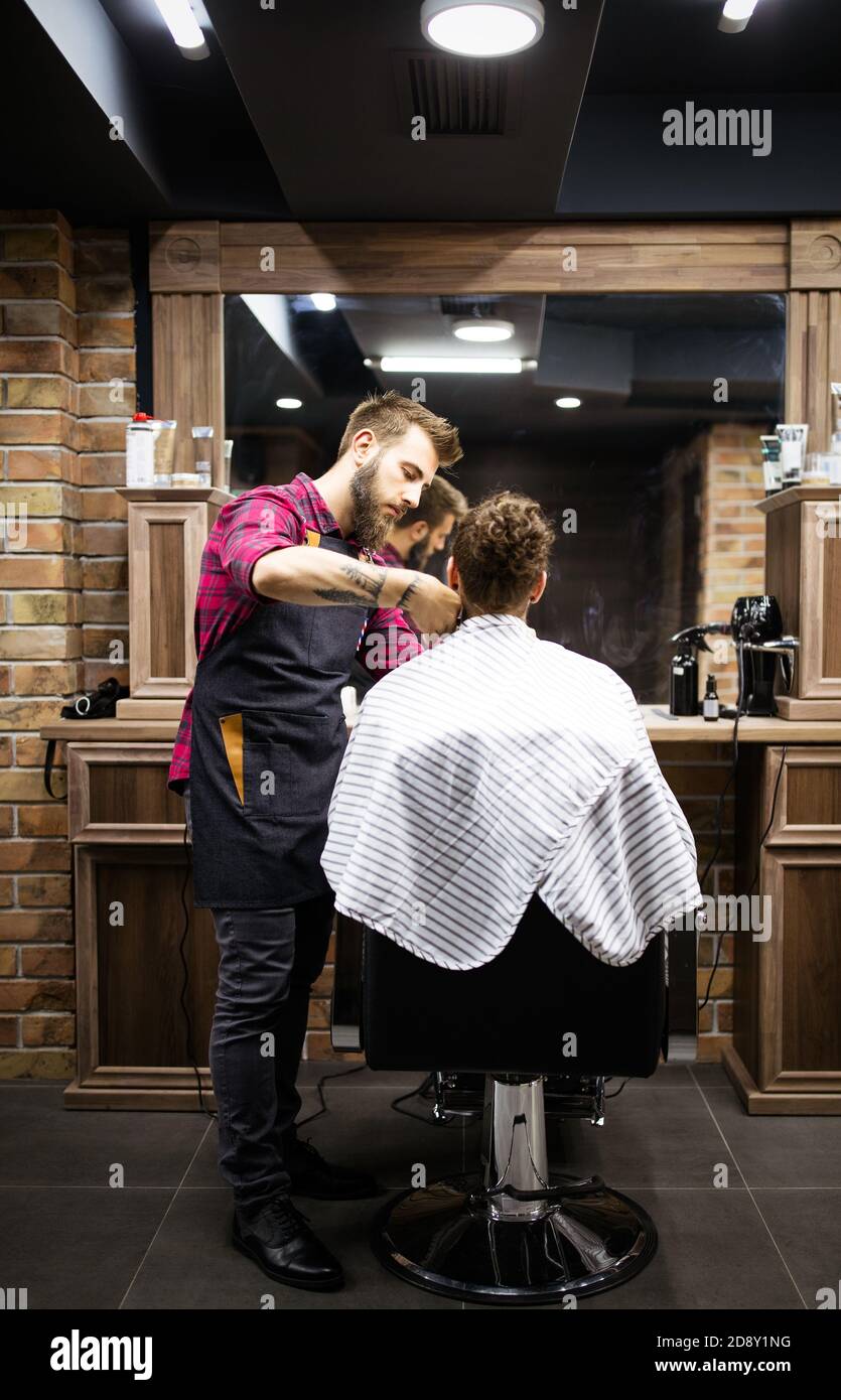 Client during beard and moustache grooming in barber shop Stock Photo Alamy
