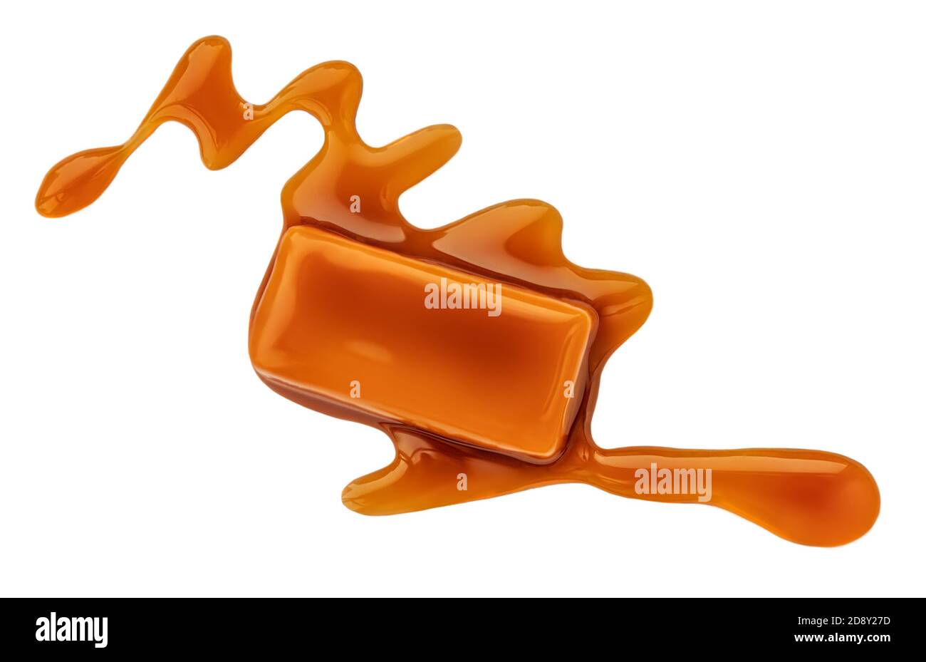 Caramel sauce flowing on caramel candies, isolated on white background