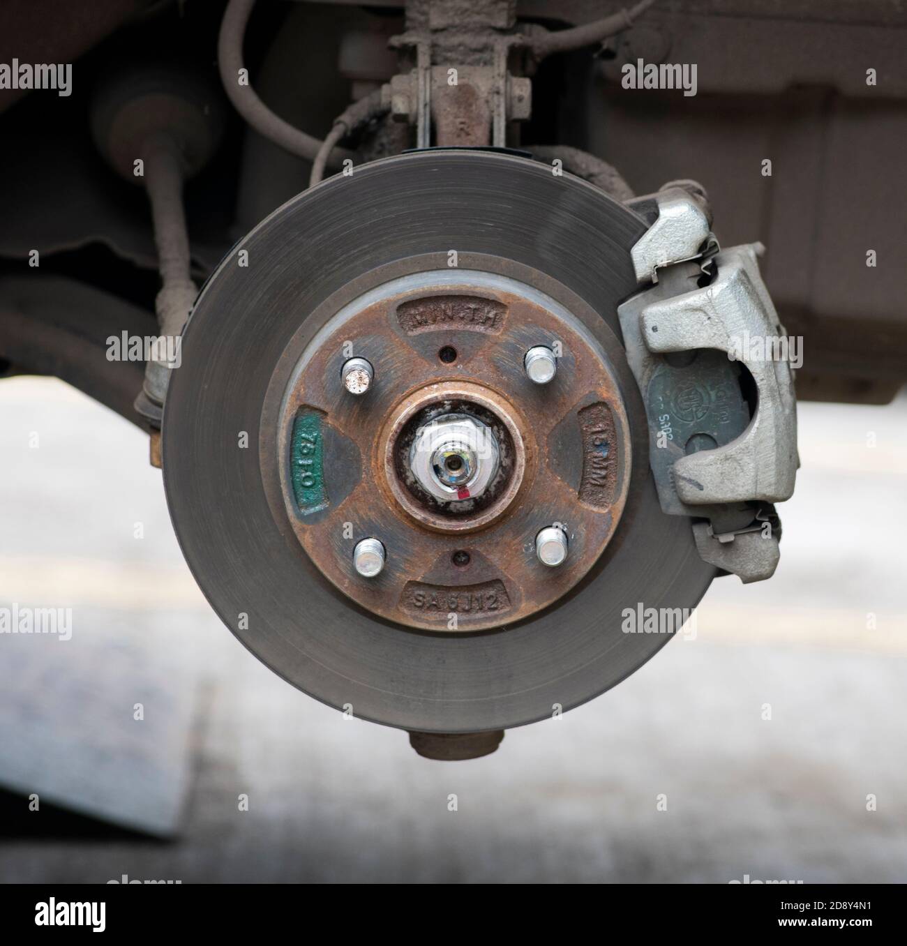 Closeup view of disc brake of small car. Location:Nashik, Maharashtra, India Date: September 06 2020 Stock Photo