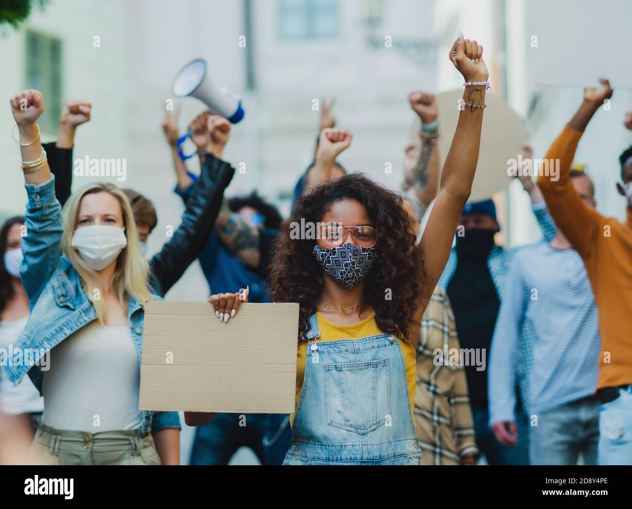 Activist Protesting Group of people activists protesting on streets, demonstration and ...