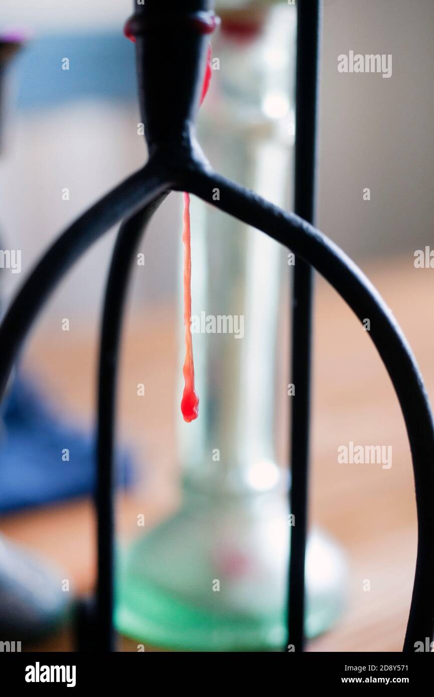 Long drip of red candle wax Stock Photo