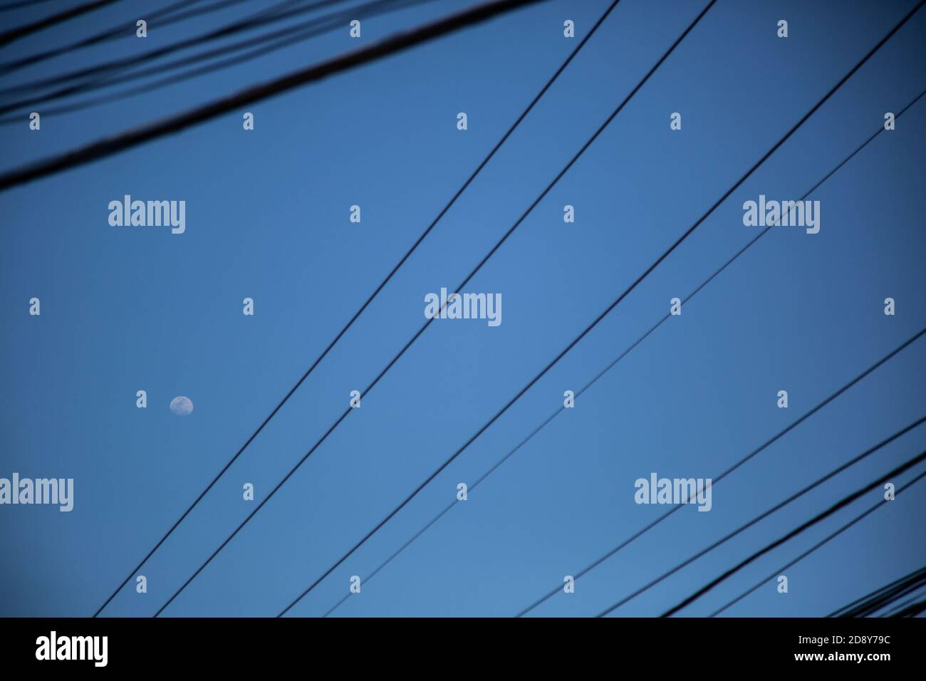 Low angle shot of electricity wires under the evening sky Stock Photo ...
