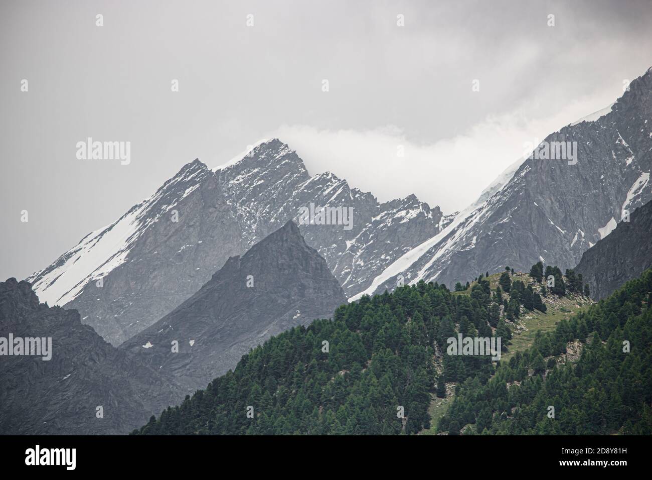 Amazing view of touristic trail near the Matterhorn in the Swiss Alps at cloudy weather Stock Photo