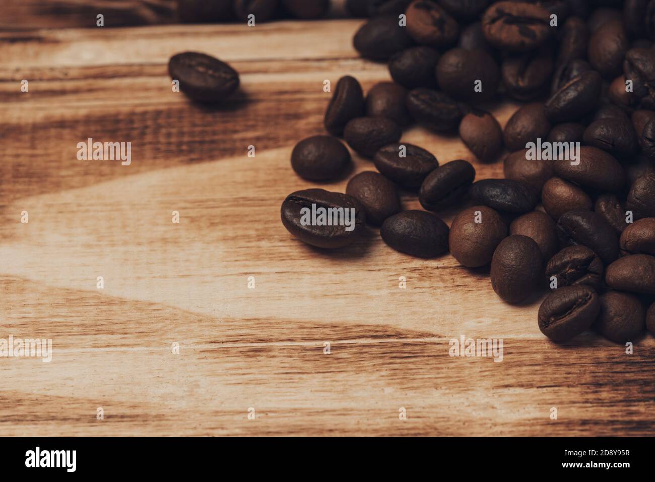 Roasted Coffee beans on wood background Stock Photo