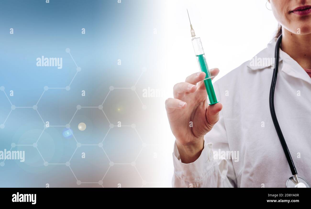 DOCTOR VACCINATING WITH UNDERLYING MEDICAL CONCEPTS Stock Photo