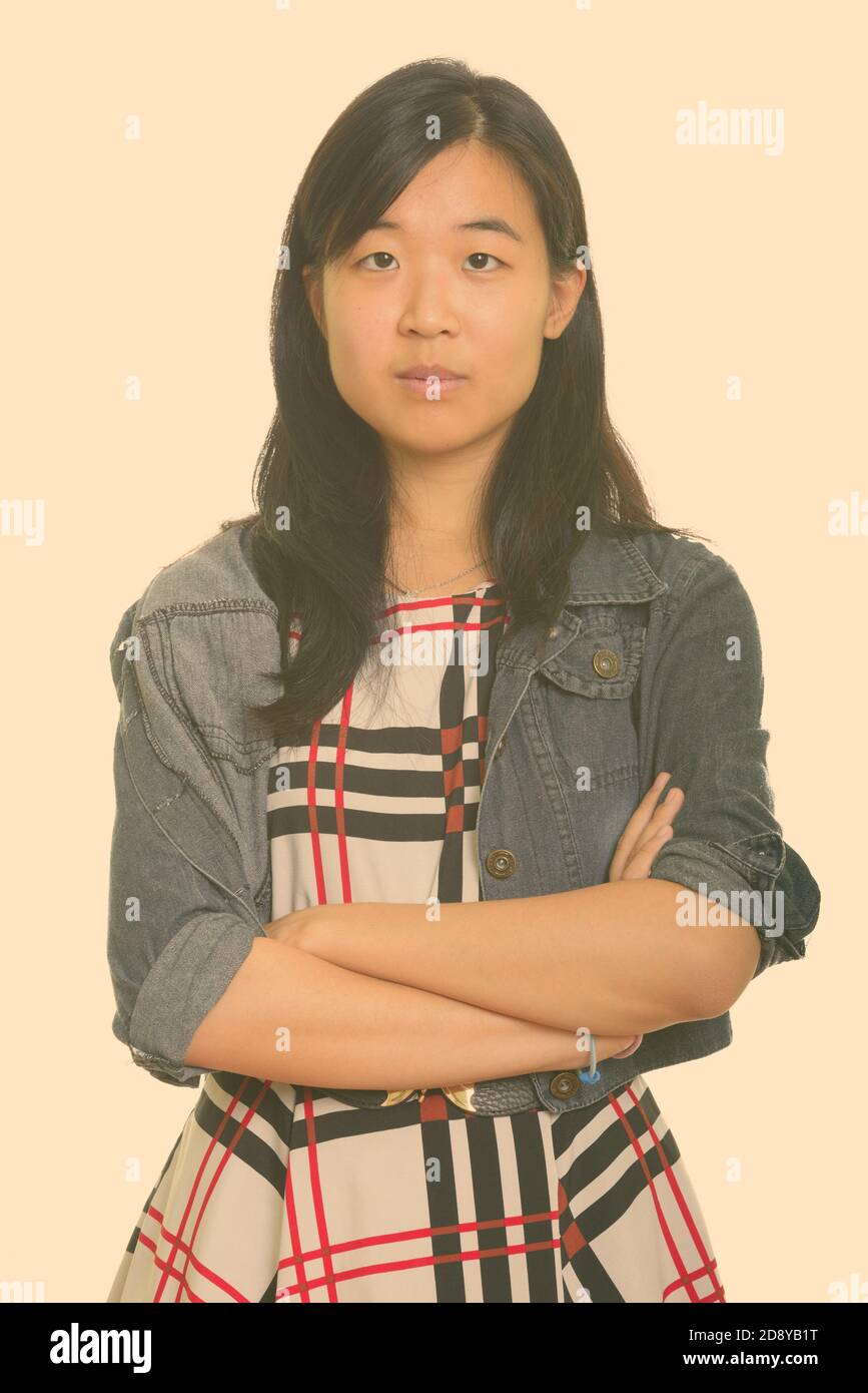 Portrait of young beautiful Asian businesswoman with arms crossed Stock ...