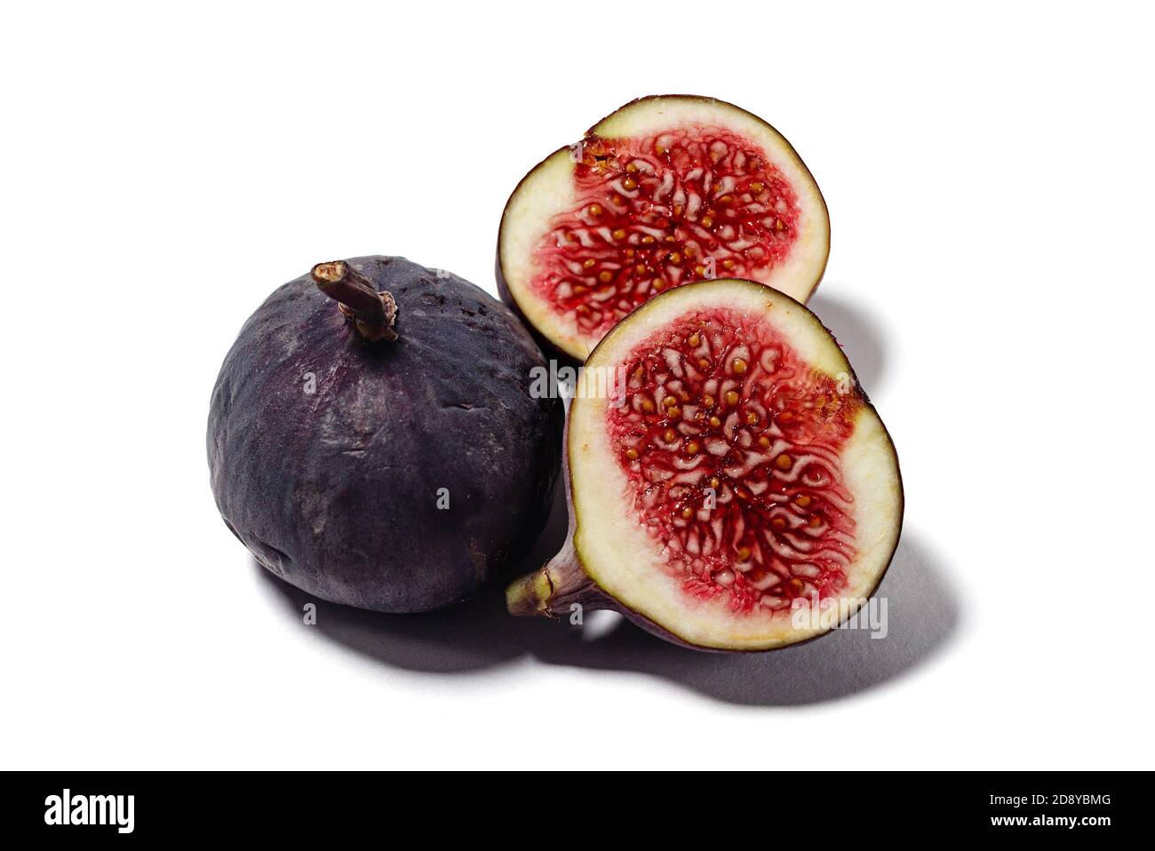 Sliced figs isolated on white. Stock Photo