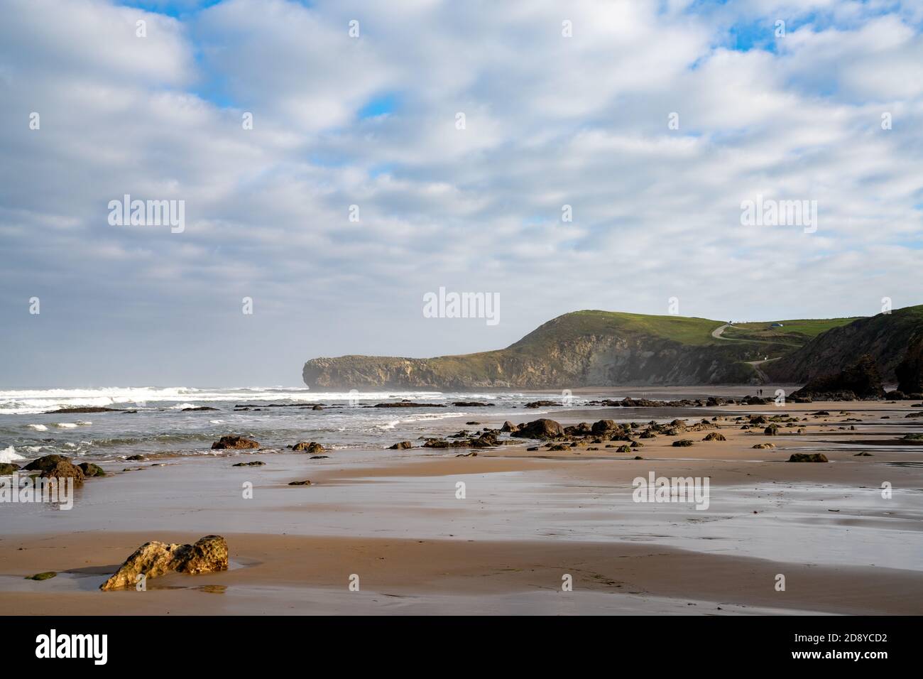A panorama view of wild and rocky and sandy beach at low tide Stock Photo