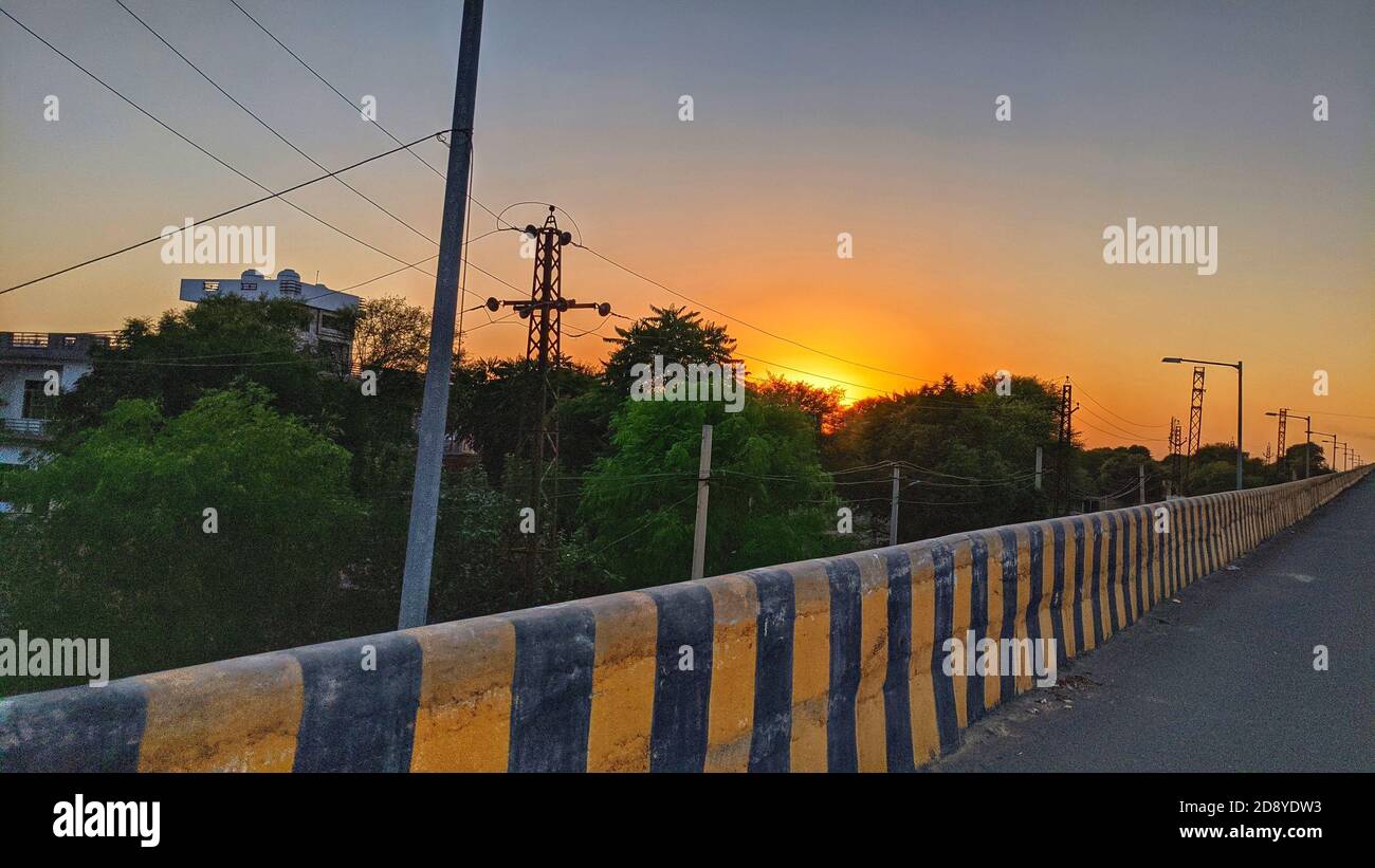 beautiful sun rising sky with asphalt highways road in rural scene use land transport and traveling background. Stock Photo