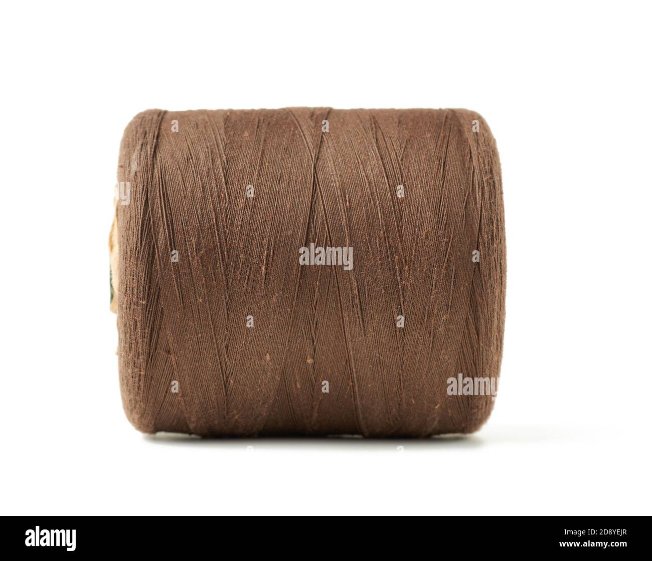 large spool with brown cotton thread isolated on white background, close up Stock Photo