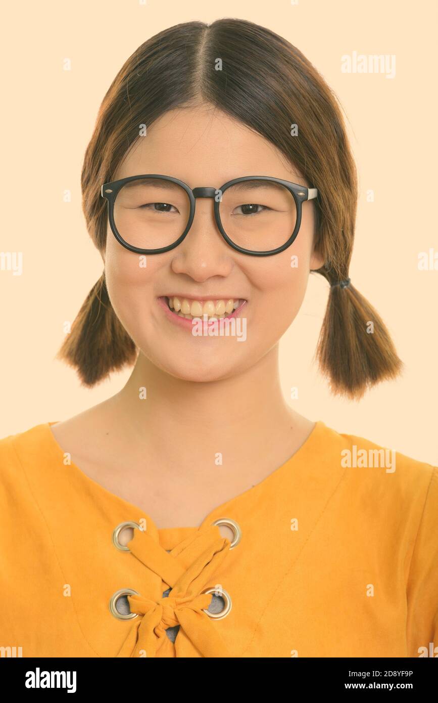 Face of young happy Asian woman smiling while wearing eyeglasses Stock ...