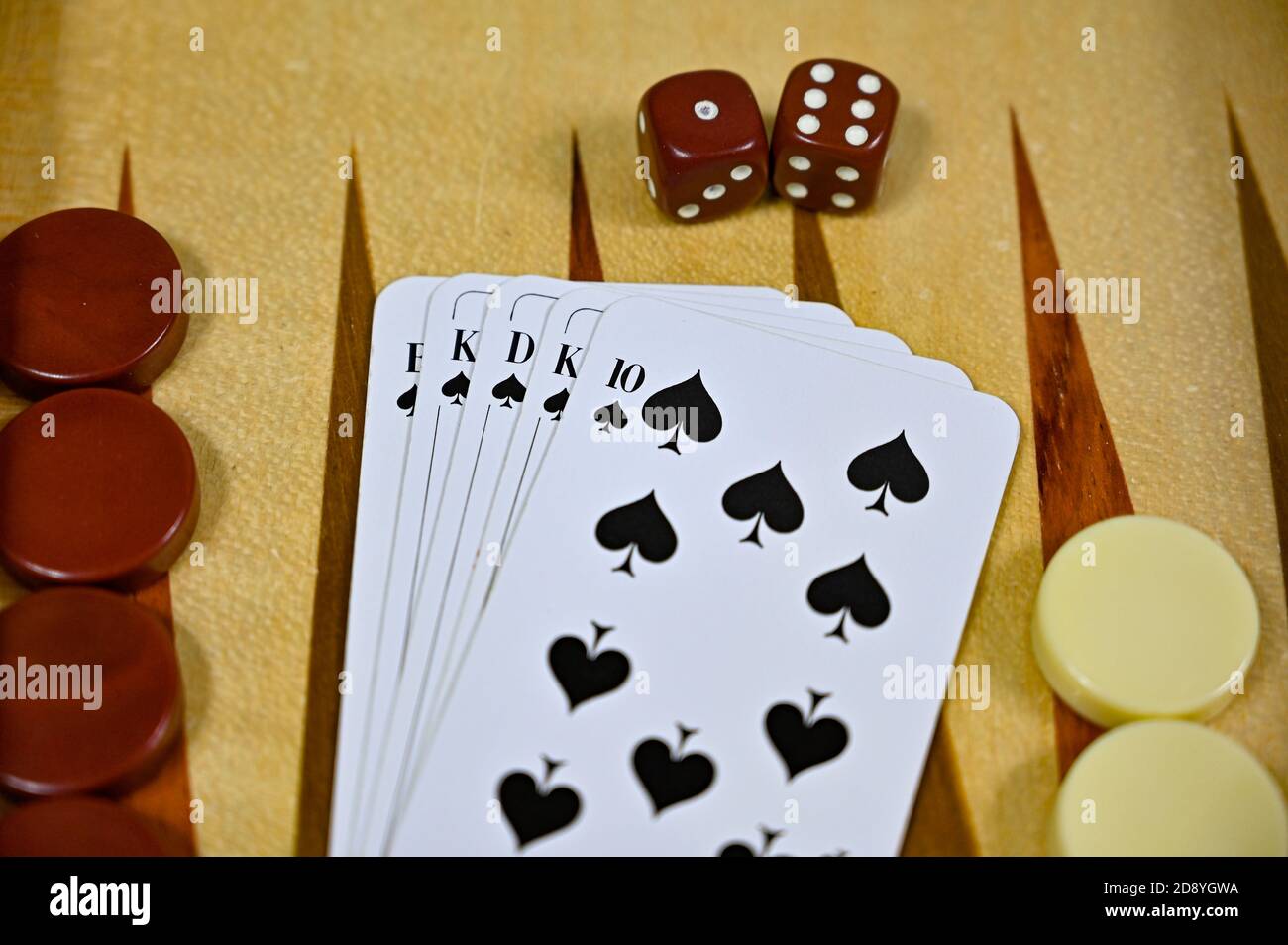 backgammon board with game pieces cards and dices Stock Photo Alamy
