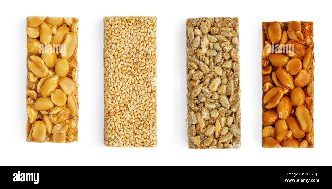 Various Granola Nut  Bars Isolated on White Background. Healthy Energy bars with peanut, sesame and caramel Top view Stock Photo