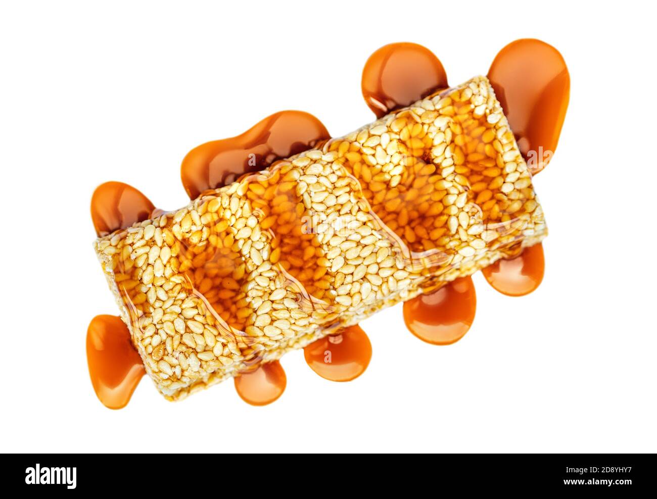 Peanut granola bar with toffee caramel isolated on white background