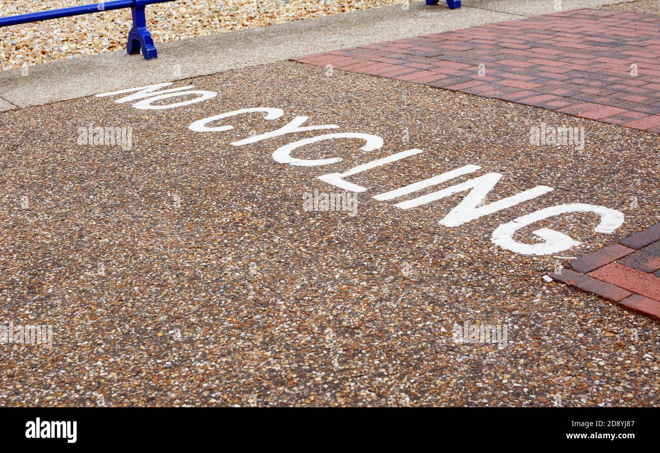 No Cycling instruction painted across a pedestrian pavement in the seaside town of Eastbourne, East Sussex Stock Photo