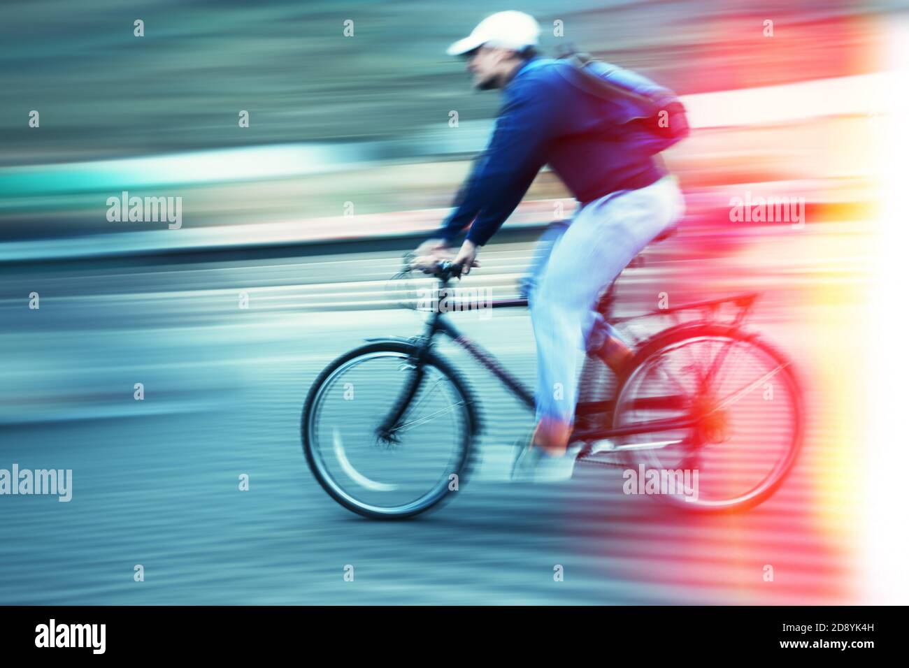Abstract image of cyclist on the city roadway. Intentional motion blur ...