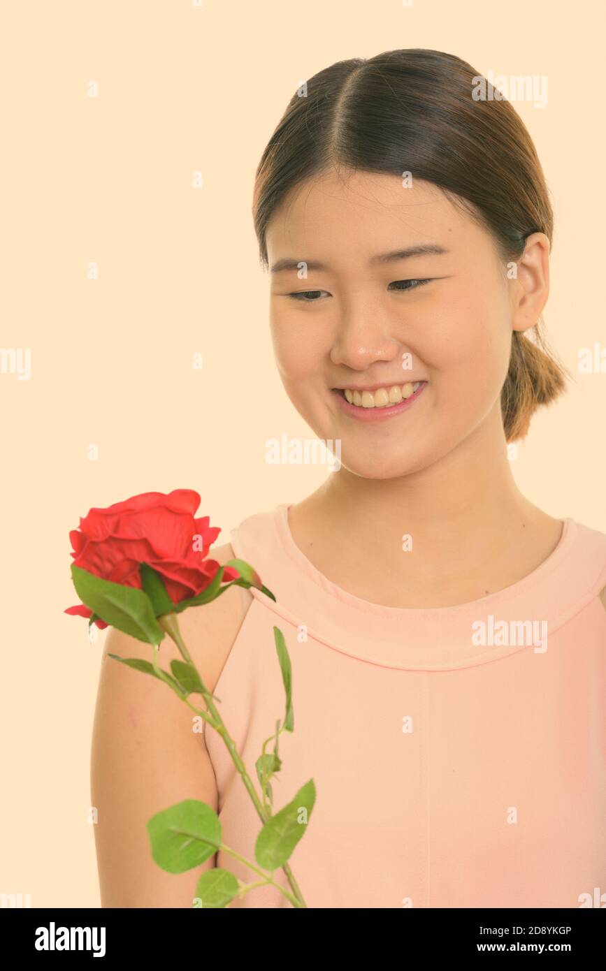 Young blond woman with large breasts holding a tiny man with a rose in her  hand, Stock Photo, Picture And Rights Managed Image. Pic. IBR-1994627