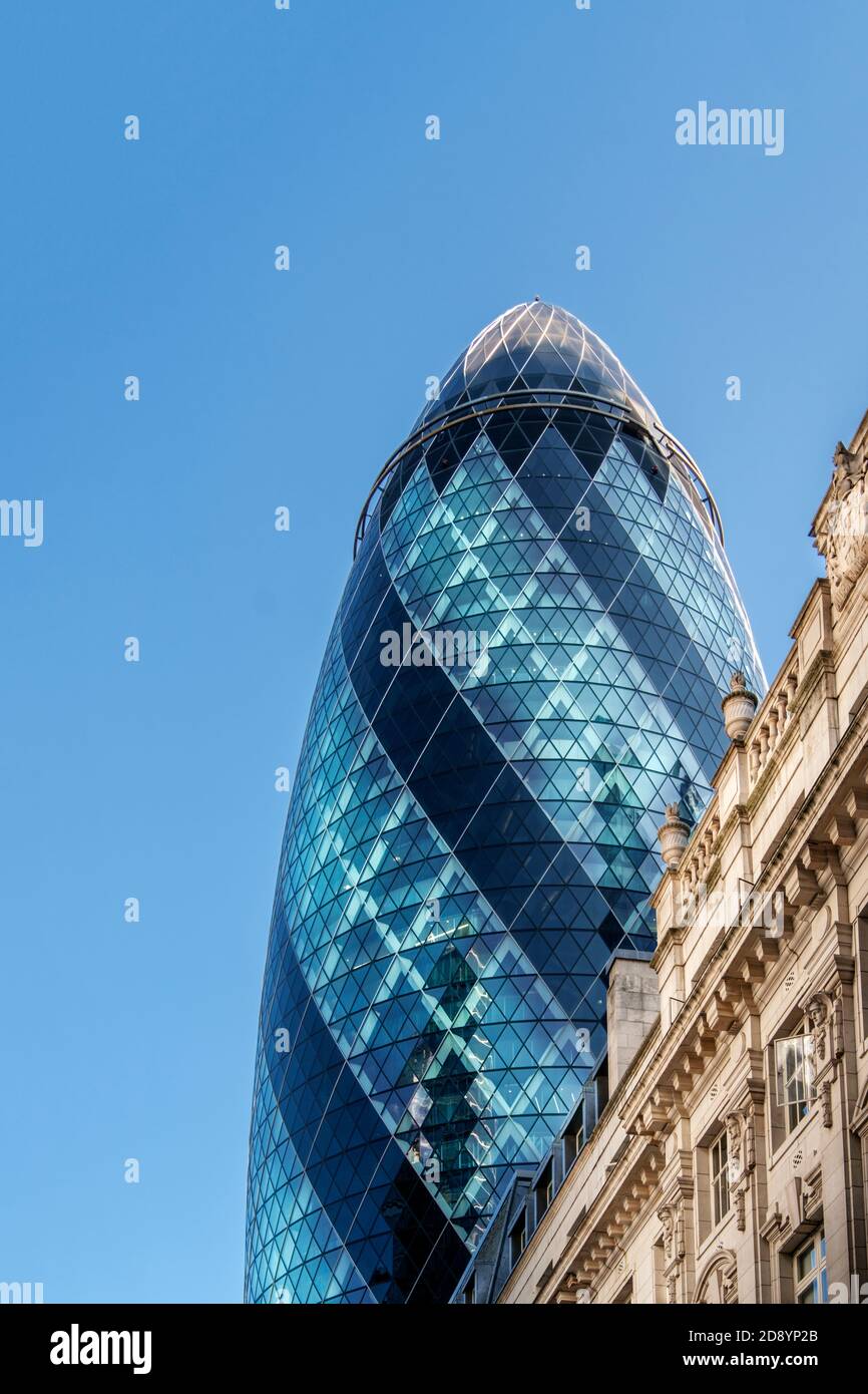 The Gherkin (30 St. Mary Axe) by Norman Foster, neoclassical 19th Century office buildings, City of London, downtown, financial district, London, UK Stock Photo