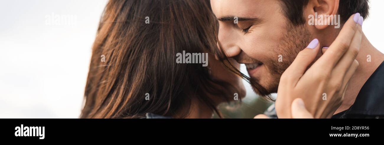 Website header of brunette woman touching boyfriend outdoors Stock ...
