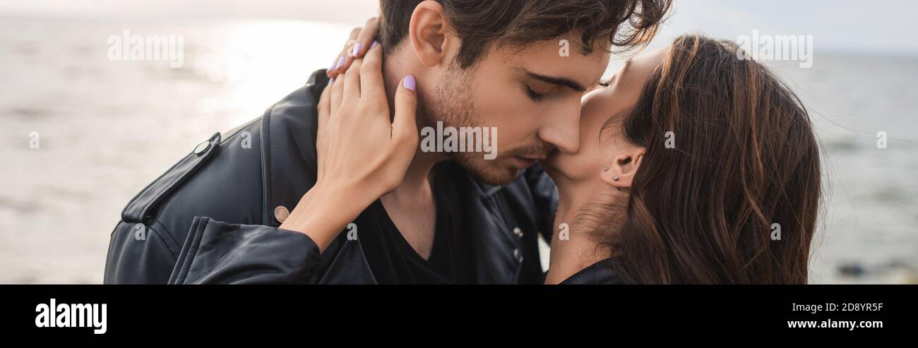 Horizontal crop of woman touching neck of boyfriend beside sea Stock ...