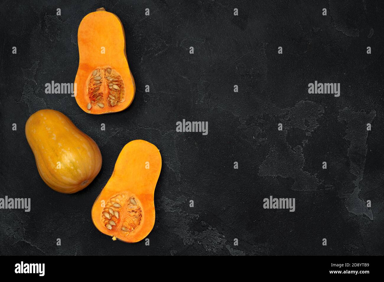 Pile of pumpkins on dark background top view Stock Photo - Alamy