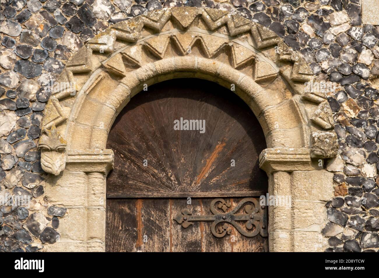 The priest's door, with Norman arch, at the south chapel of St Mary and St Peter's church, Kelsale, Suffolk, UK Stock Photo