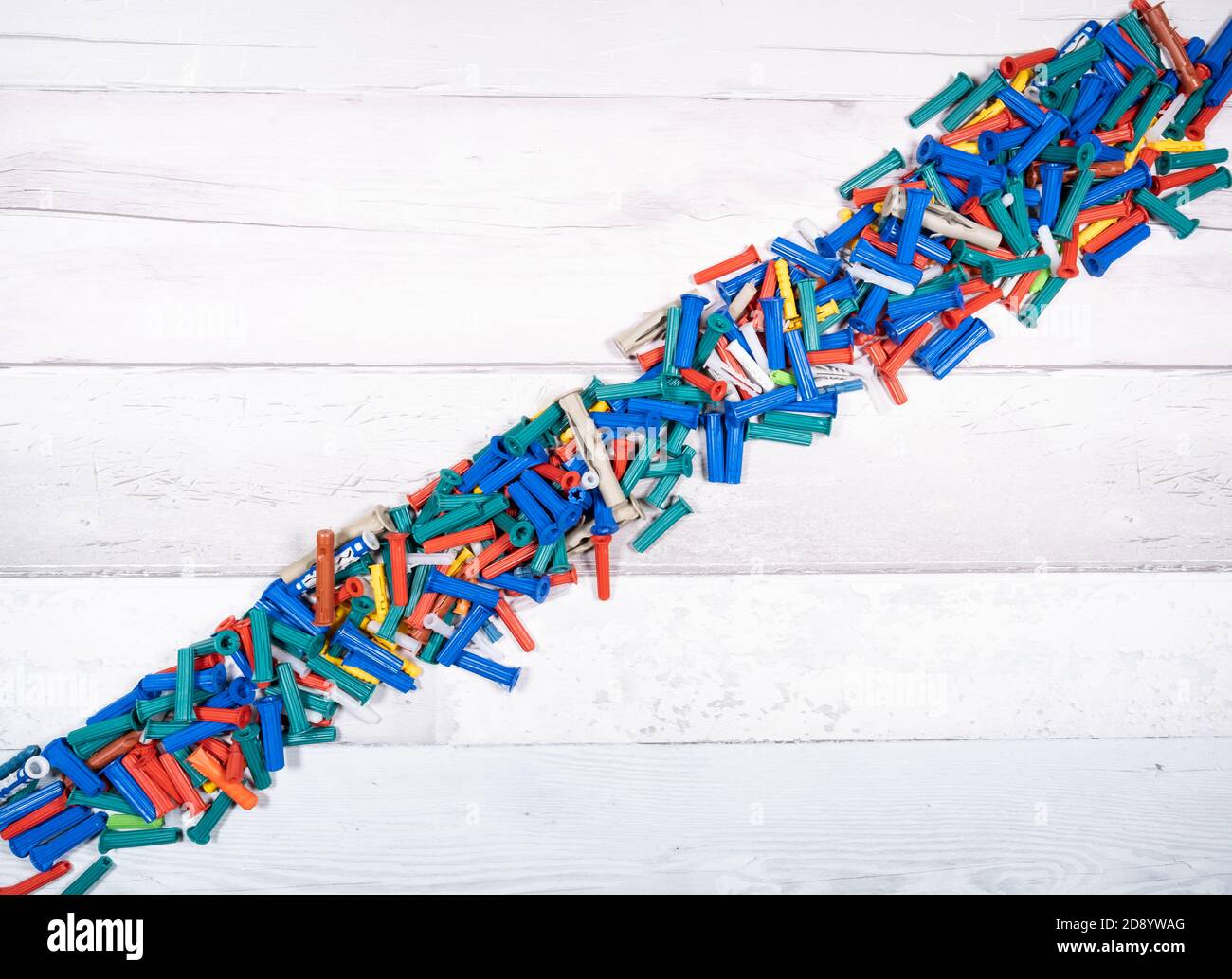 Set of different dowels for wood, concrete, plaster on an old wooden