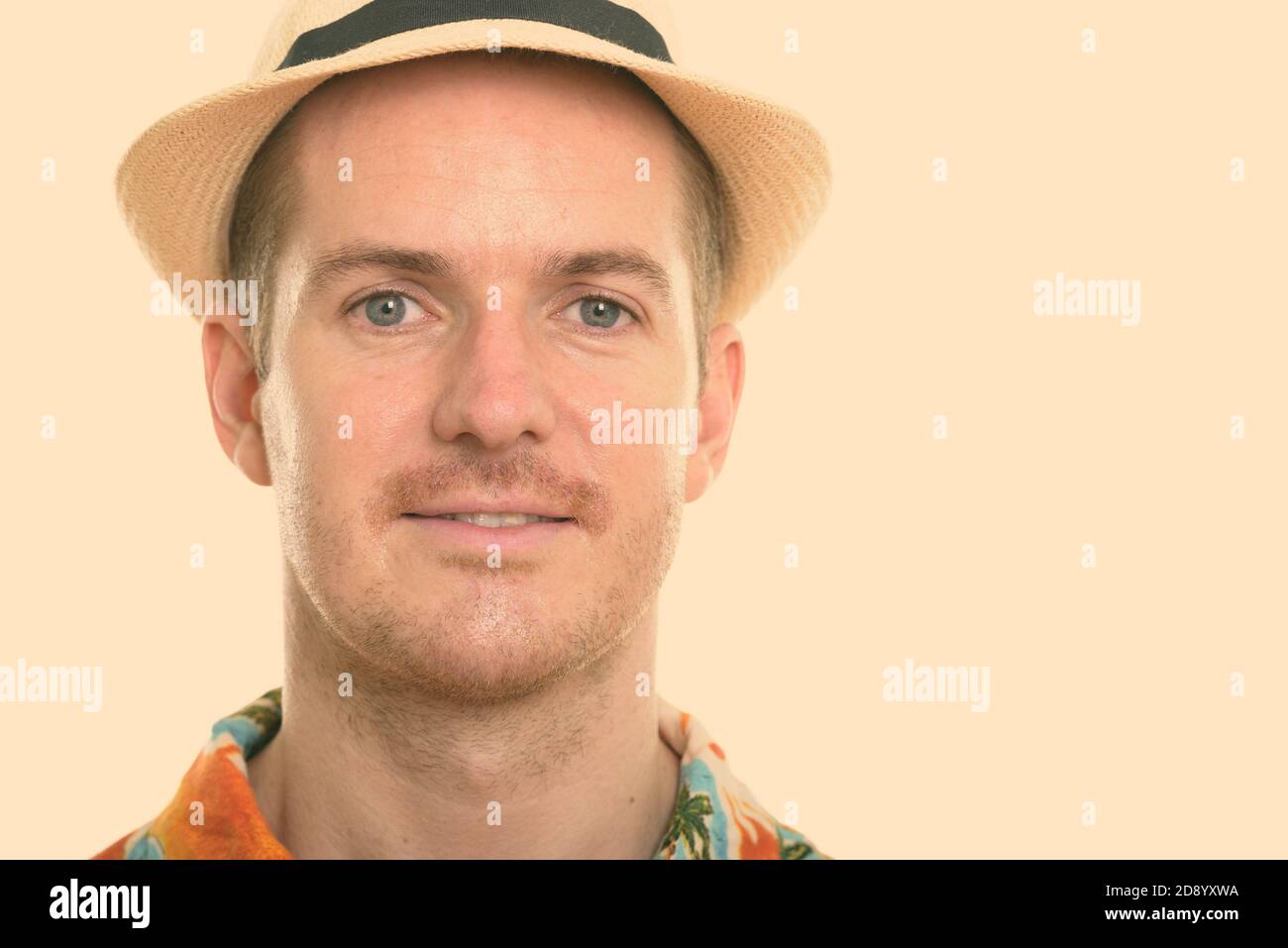 Face of happy man smiling while wearing Hawaiian shirt and hat ready ...