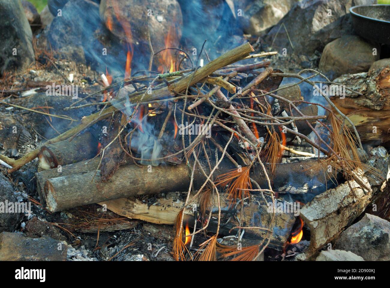 camp fire burning in a fire pit Stock Photo Alamy