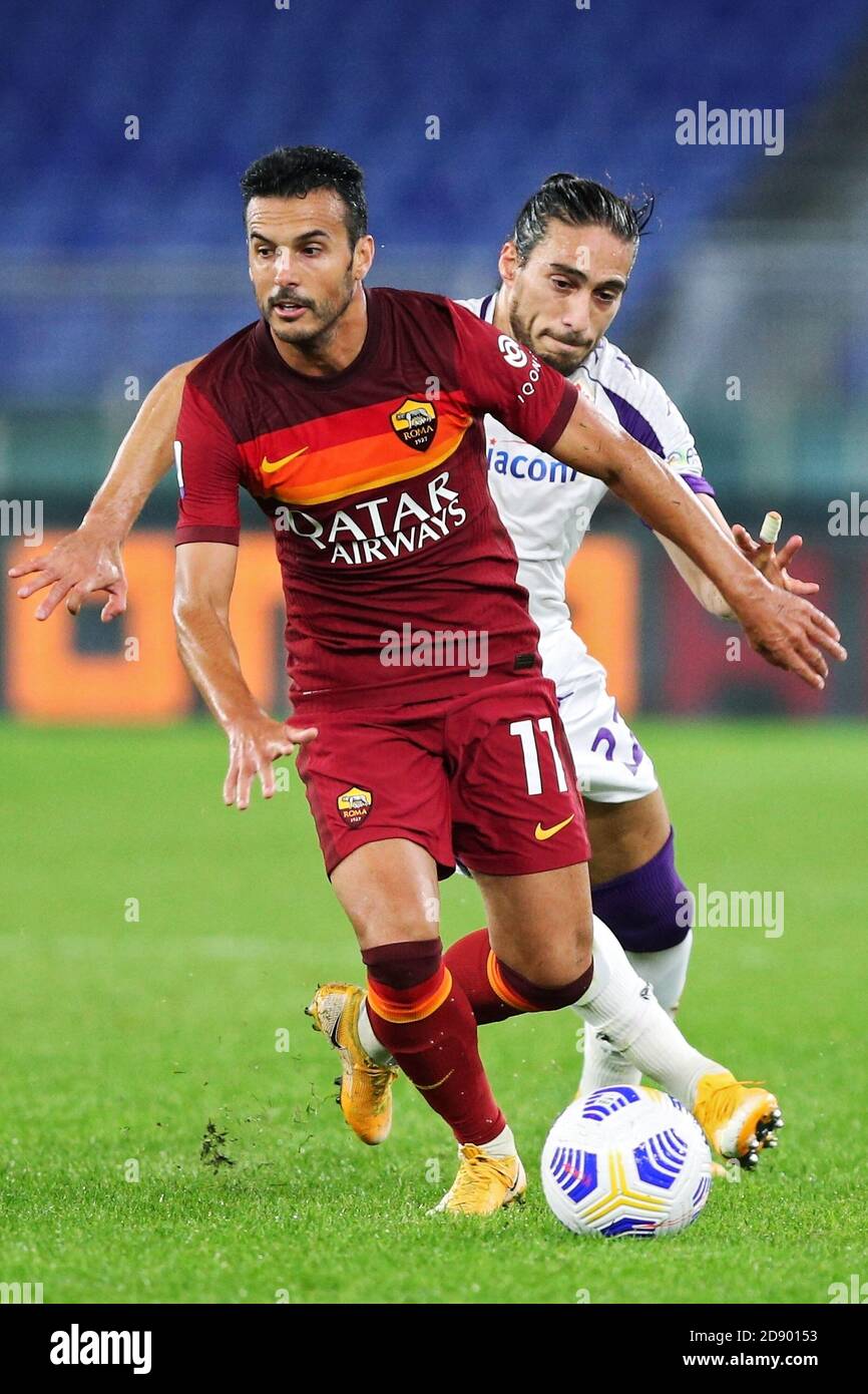 Pedro Rodriguez of Roma (L) vies for the ball with Martin Caceres of Fiorentina (R) during the Italian championship Serie A football match between A C Stock Photo