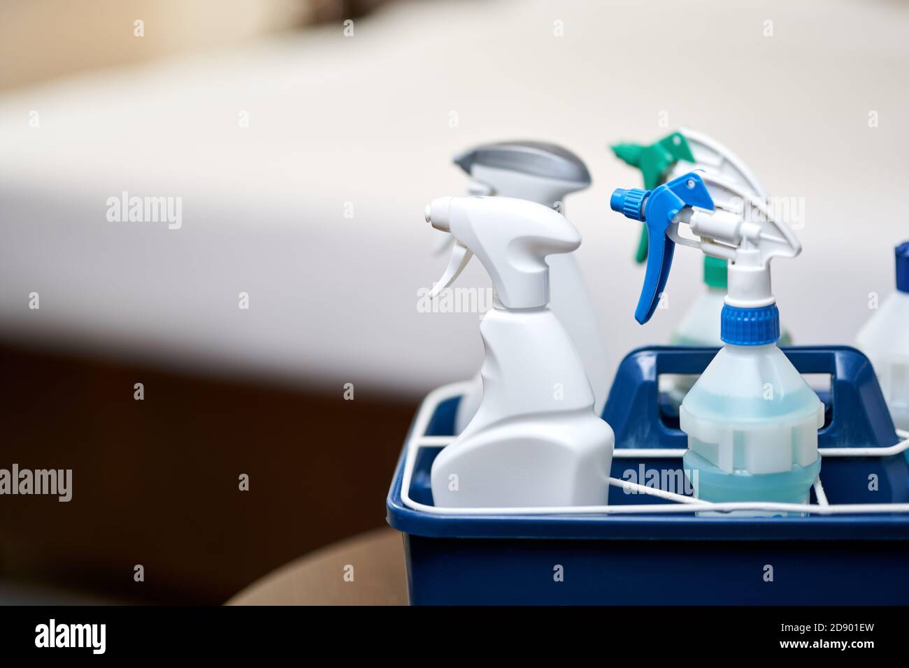 Close up of basket with cleaning items for room cleaning. Copy space. Housekeeping and hygiene
