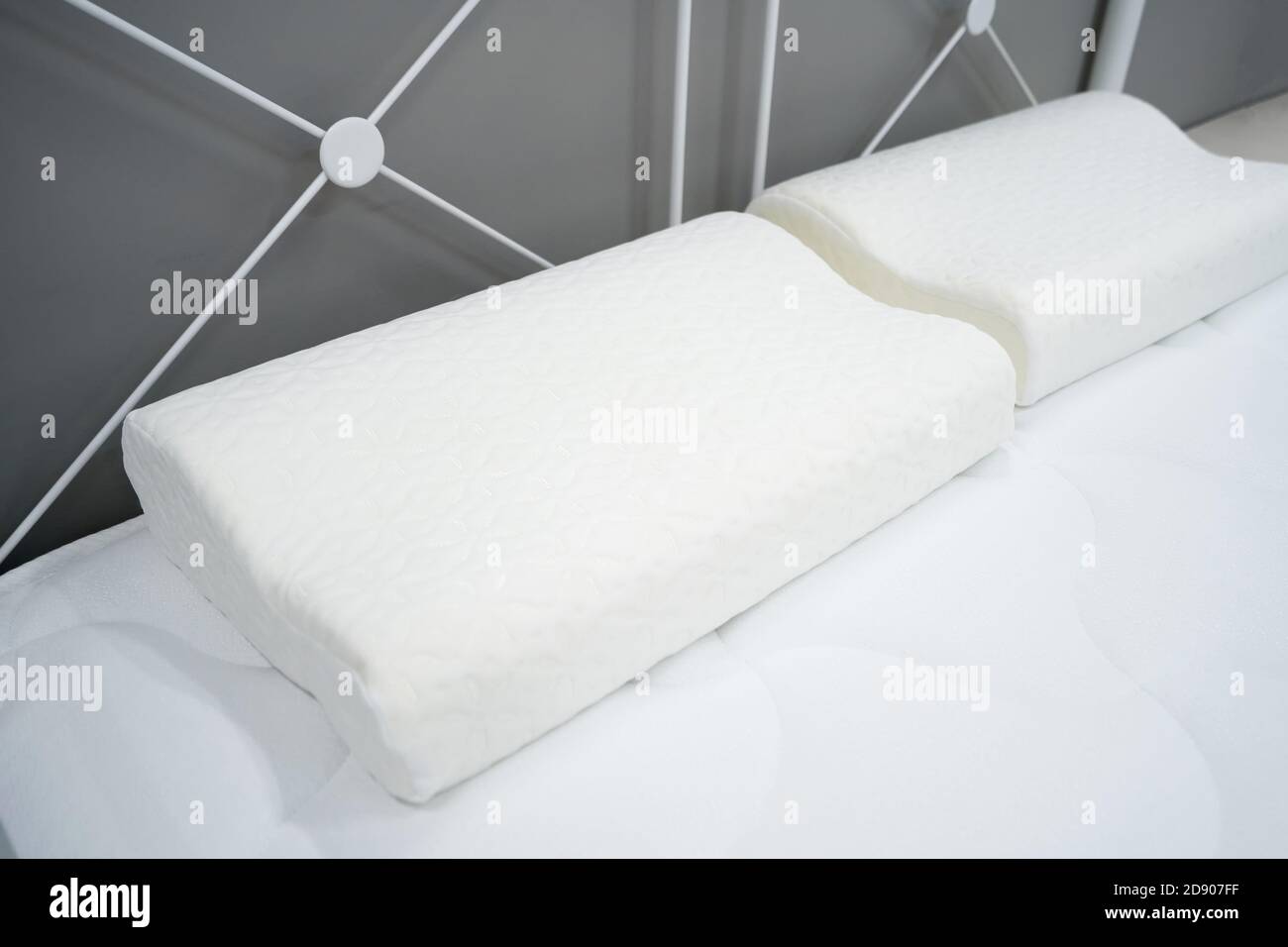 Orthopedic pillows for healthy sleep on a white mattress Stock Photo