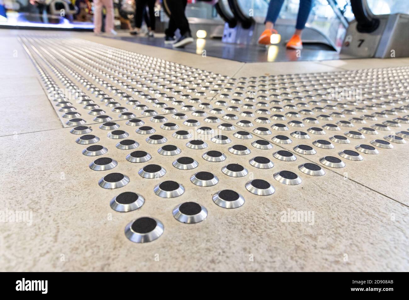 Metal floor tactile to guide vision impaired person at mall Stock Photo