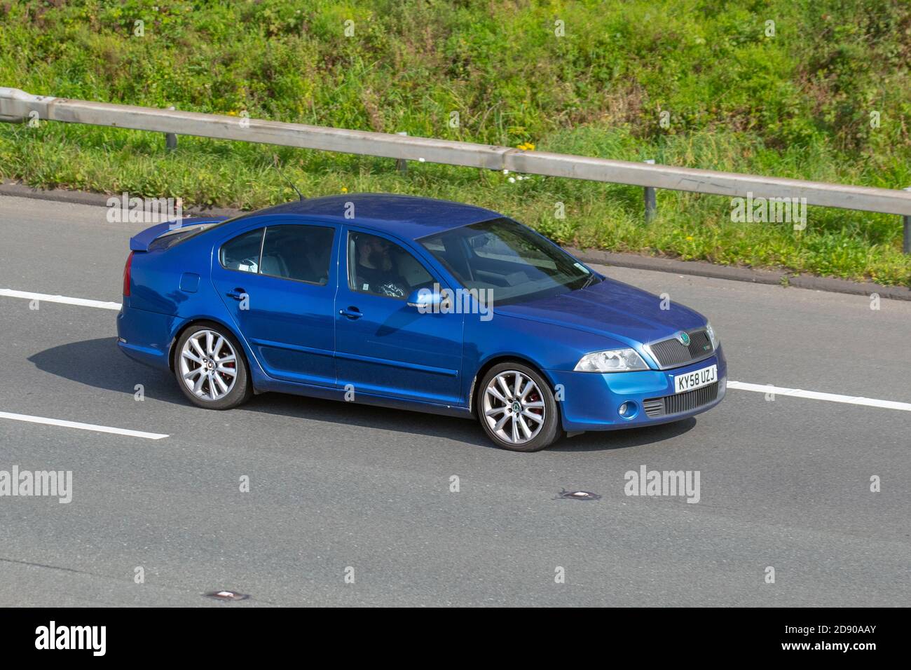 2008 08 blue Škoda Octavia VRS TDI CR; Vehicular traffic, moving vehicles, cars, vehicle driving on UK roads, motors, motoring on the M6 motorway highway UK road network. Stock Photo