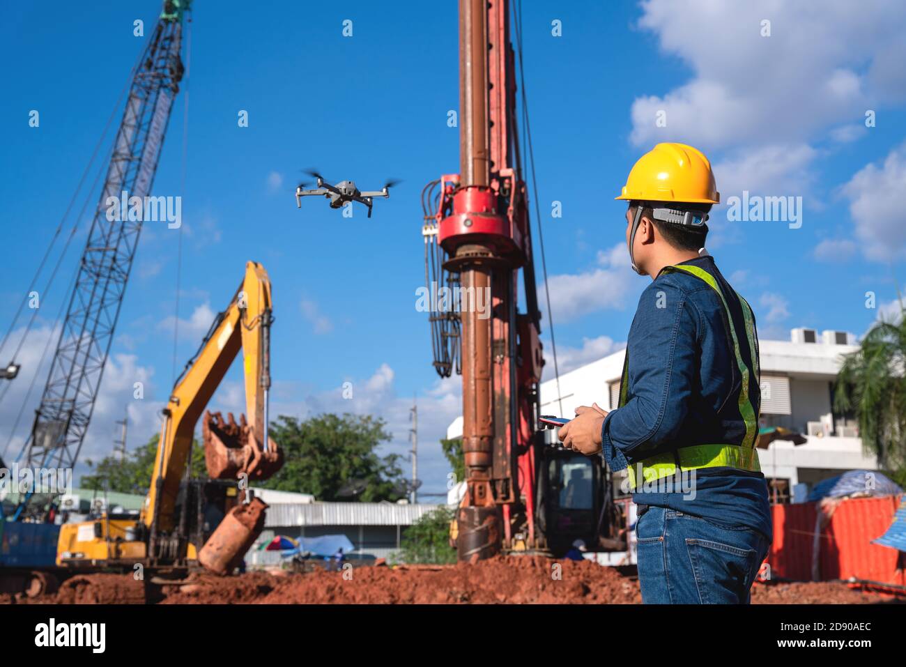 Drone inspection new construction site. Operator inspecting new construction site control by civil engineer Stock Photo