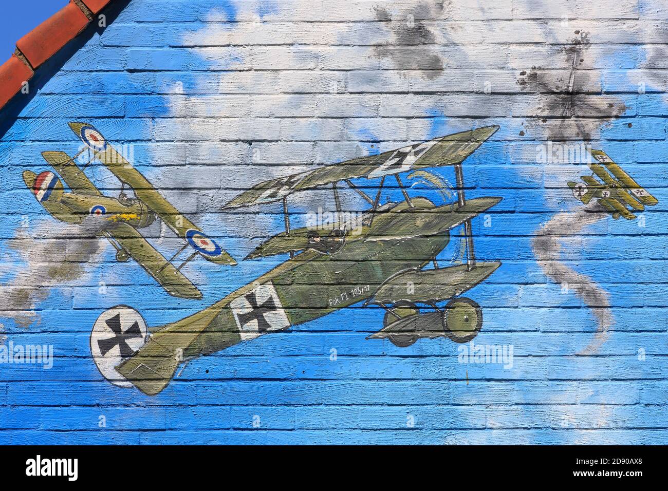 Mural painting with British and German fighter planes on the facade of the Dreve restaurant/cafe in Polygon Wood near Zonnebeke, Belgium Stock Photo