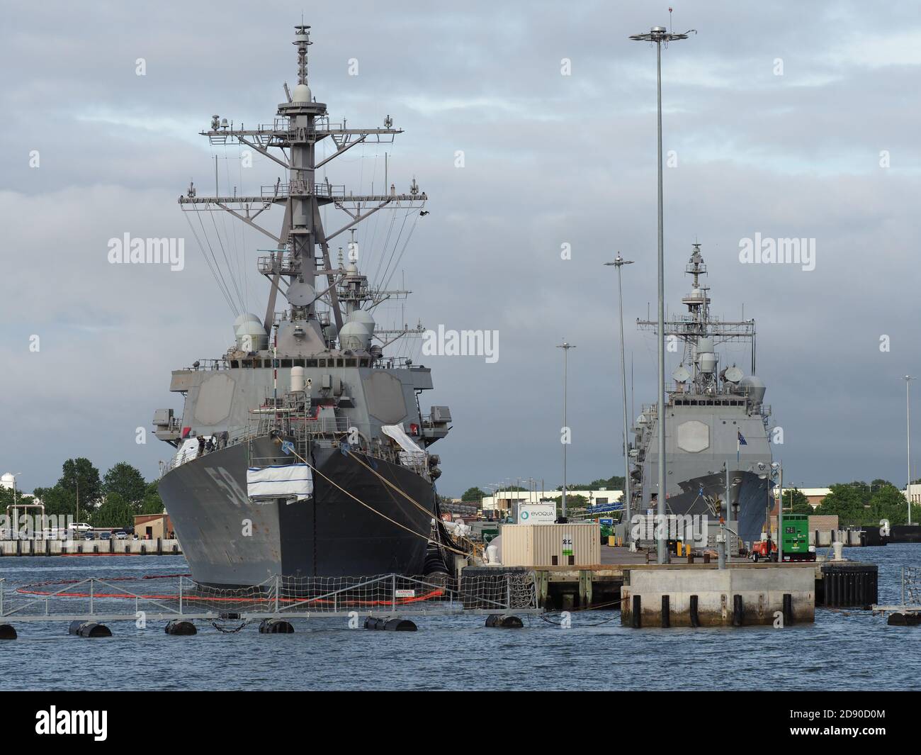 Several naval vessels anchor in the Norfolk Naval Base. Stock Photo