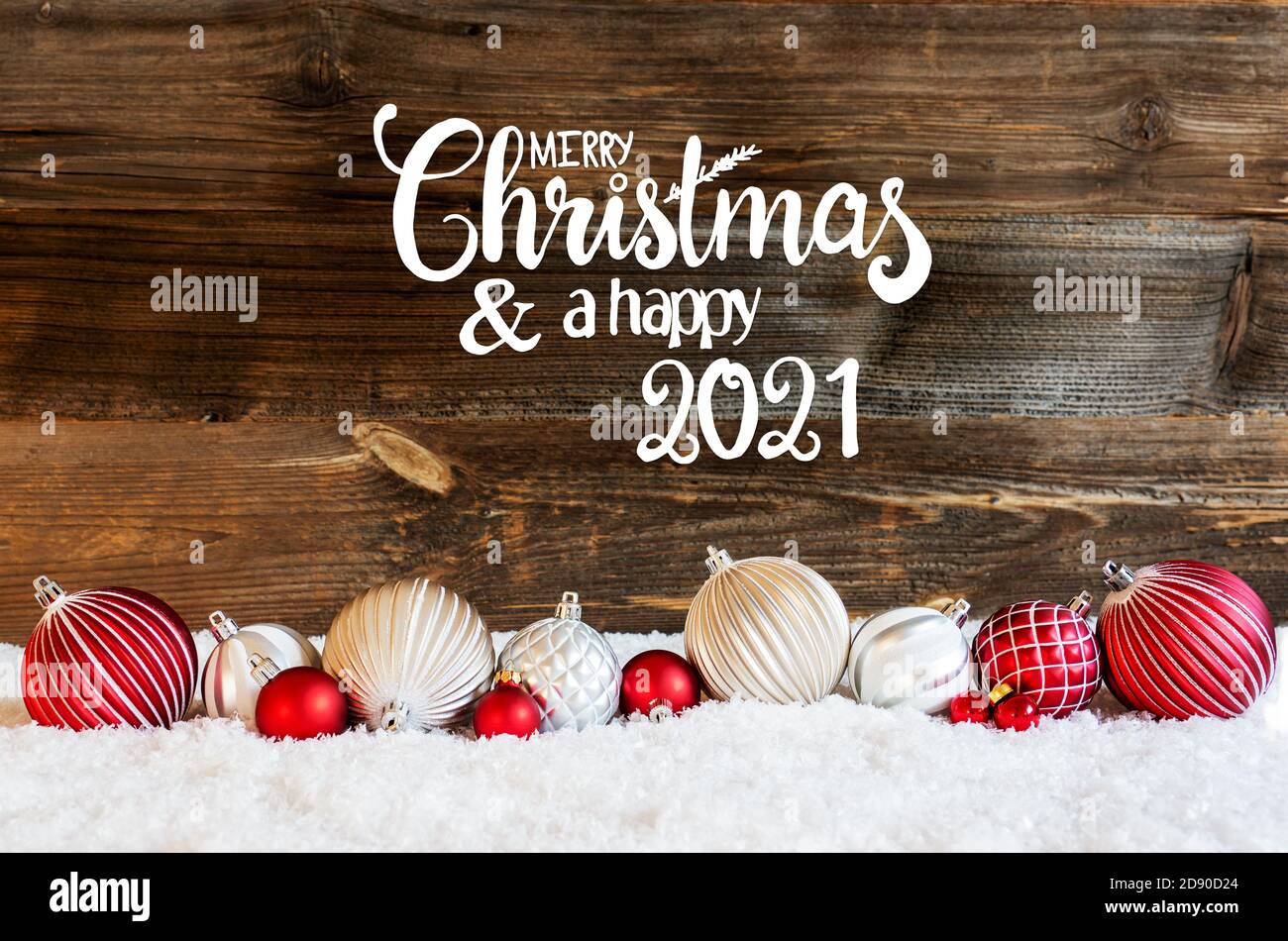 Christmas Ball Ornament, Snow, Calligraphy Merry Christmas And A Happy 2021 Stock Photo