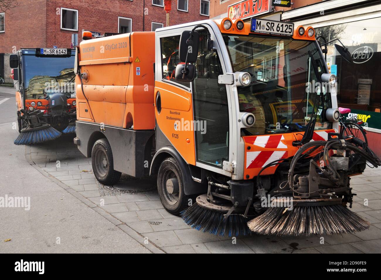Road sweeper machine car stopping beside road wait driver worker