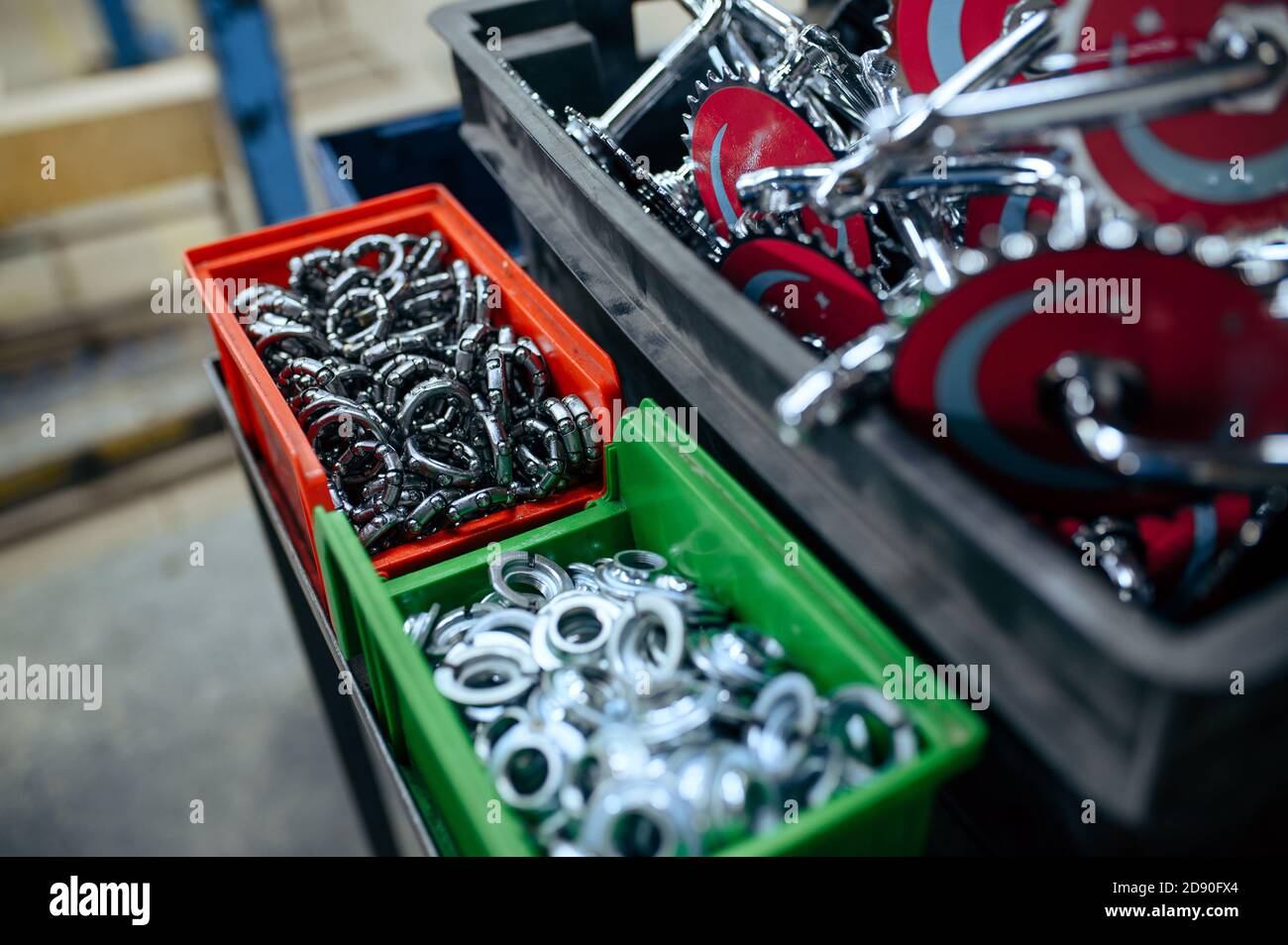 Bicycle factory, boxes with bike parts, closeup Stock Photo Alamy