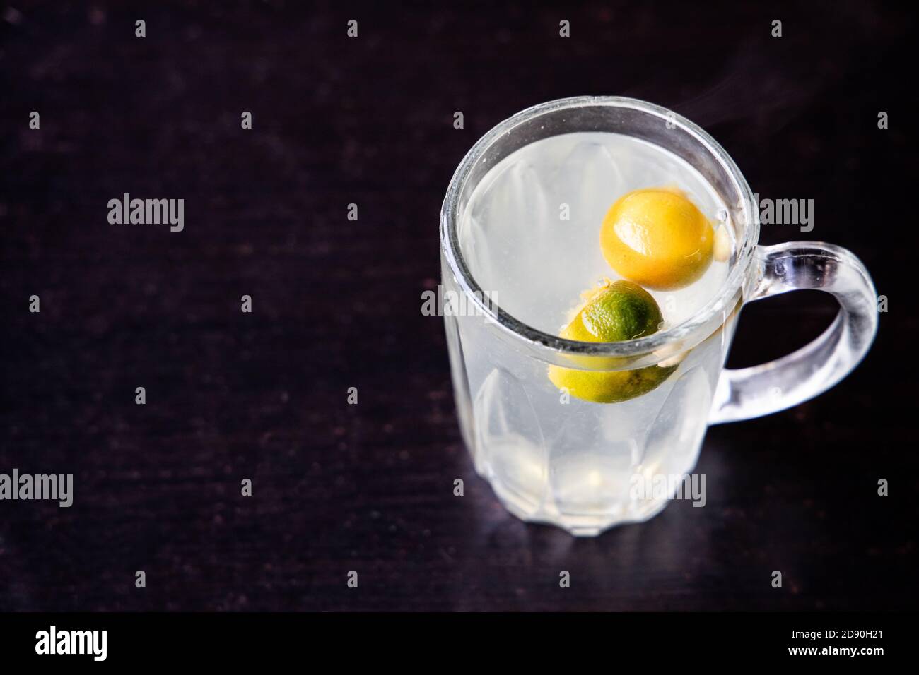 Hot refreshing calamansi lime juice in drinking glass Stock Photo