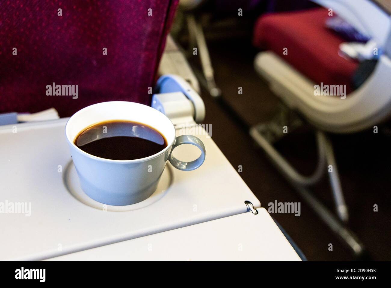 Cup of hot black coffee on table in plane cabin Stock Photo Alamy
