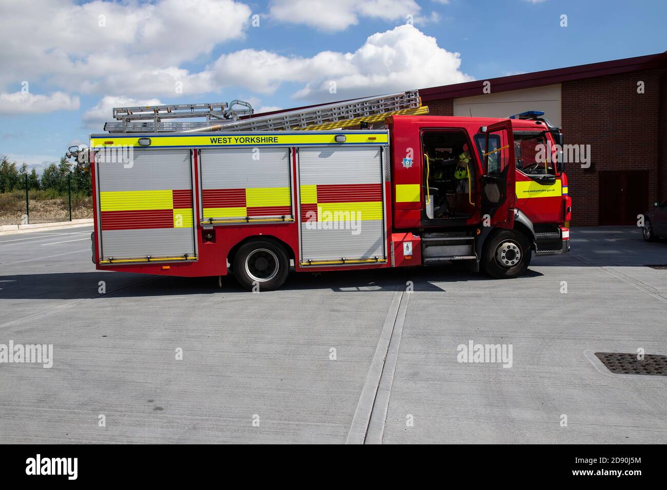 A modern English unmanned fire engine awaits operational checks at Ossett fire station in Wakefield, West Yorkshire U.K. Stock Photo