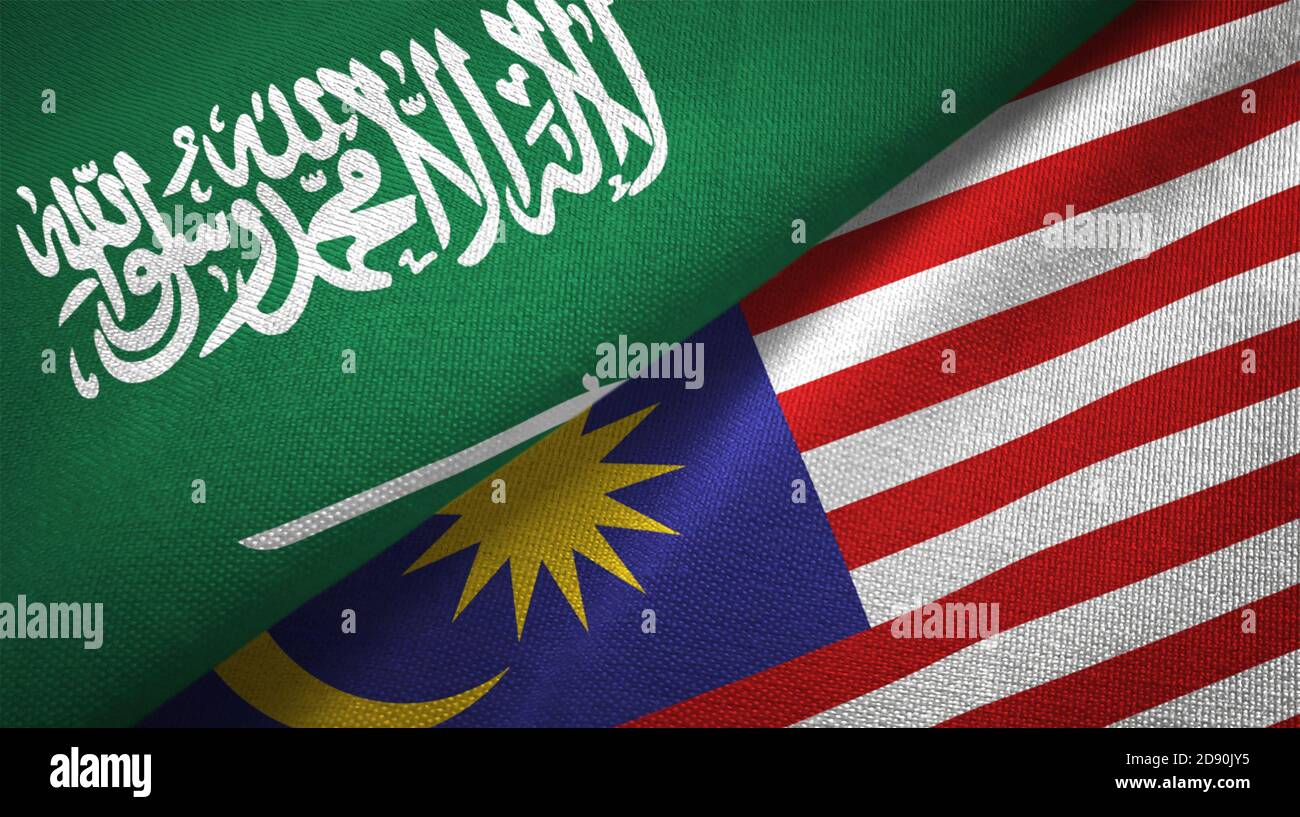 Malaysia and Saudi Arabia flags together relations textile cloth fabric texture Stock Photo