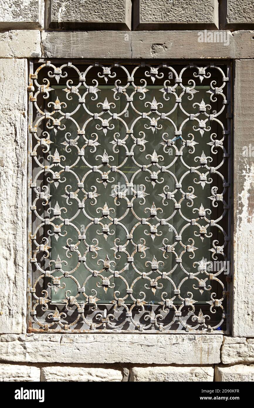 texture of a wall with windows and metal gratings Stock Photo - Alamy