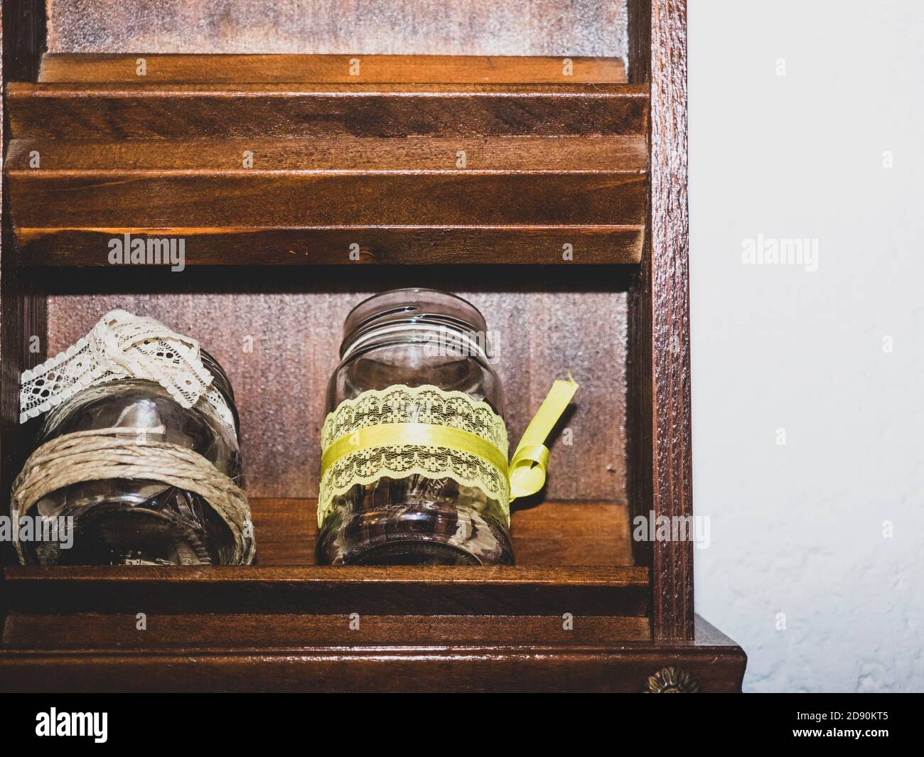 jars decorated with sugar and bottles of oil front view Stock Photo